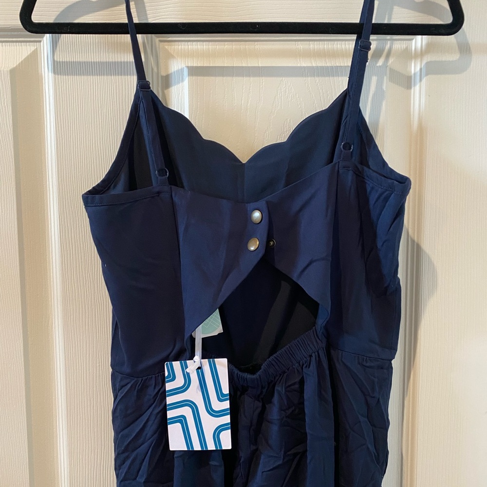 Super cute navy jumpsuit with scalloped edges